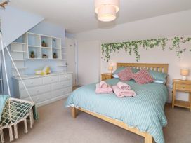 A bedroom with a bed and storage furniture at Cootiya Corner in Great Lyth