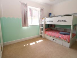 A bedroom with a bunk bed and window at Cootiya Corner Great Lyth