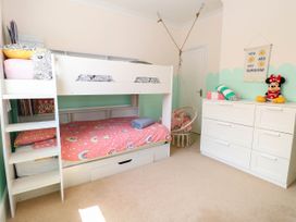 A bedroom with a bunk bed and dressers at Cootiya Corner in Great Lyth