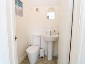 A bathroom with a toilet and sink at Cootiya Corner in Great Lyth