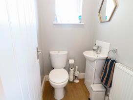 A bathroom with a toilet and sink at Cootiya Corner in Great Lyth