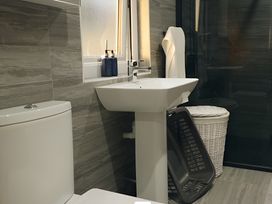 A bathroom with a toilet and wash basin at The lodge at Plumstone View Haverfordwest