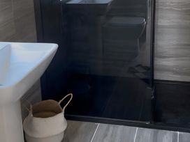 A bathroom with a sink, toilet, and shower at The lodge at Plumstone View Haverfordwest