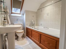 A bathroom with a sink, toilet, and bathtub at Ellishayes Farm in Combe Raleigh