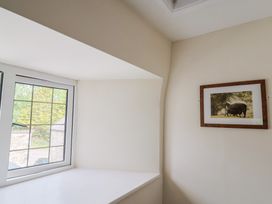 A room with a window and a picture frame at Ellishayes Farm in Combe Raleigh
