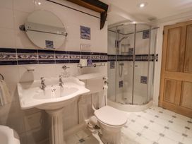 A bathroom with a sink, toilet, and shower at Ellishayes Farm in Combe Raleigh