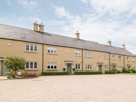 A row of houses with bushes in front at East View in Cheltenham