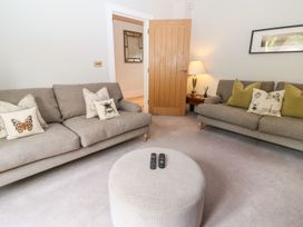A living room with sofas and a coffee table at East View in Cheltenham