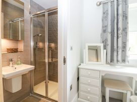 A bathroom with a shower and vanity at East View in Cheltenham