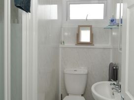 A bathroom with a toilet and sink at 228b Eighth Avenue in Bridlington