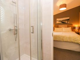 A shower and bedroom visible in 6 Waterside, White Cross Bay near Windermere