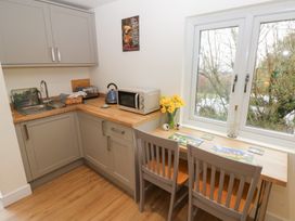 A kitchen with a sink and appliances at Heidiaway Lodge in Porth