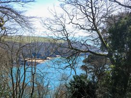 A view of water and trees at Blackstone Cottage in Salcombe