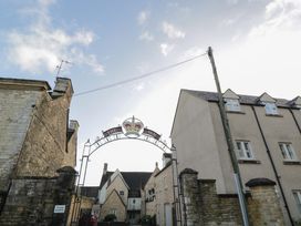 A sign for The Inn with buildings and a road at Flat 6 in 