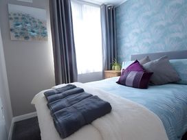 A bedroom with a bed and pillows at 226 Third Avenue in Bridlington
