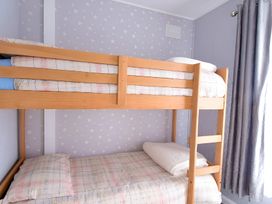 A bunk bed with pillows and bed linen at 226 Third Avenue in Bridlington