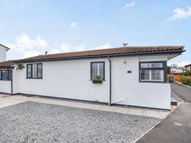 A house exterior with windows and planter at 6 Tegafan in Abergele