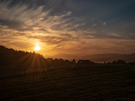 A sunset view over a landscape at Nethermill Lodges Port Glasgow
