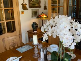A dining room with a table set and decorative objects at Fenton Drive in Wooler