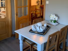 A dining room with a table set for tea at Fenton Drive Wooler