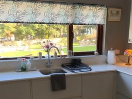 A kitchen with a sink and dish rack at Fenton Drive Wooler