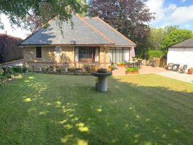 A house with a garden and patio area at Fenton Drive in Wooler
