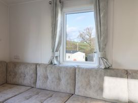 A living room with a couch and a window at WF32 - Jurassic Discovery, Charmouth
