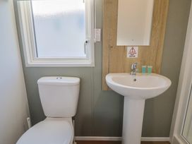A bathroom with a toilet and sink at WF32 - Jurassic Discovery in Charmouth