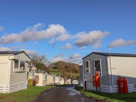 A view of static caravans along a road at WF32 - Jurassic Discovery, Charmouth