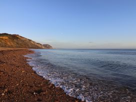 A beach with waves lapping on the shore at WF32 - Jurassic Discovery, Charmouth