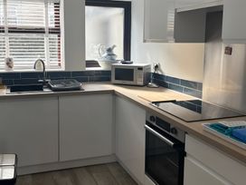 A kitchen with sink and countertop at Penmaenmawr Coastal Retreat