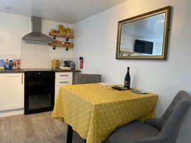 A kitchen with a table and chairs at The Haven in Penrith