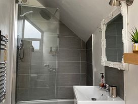 A bathroom with a shower and sink at The Haven in Penrith