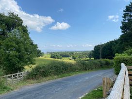A view of a rural landscape with a road and trees at The Haven in Penrith