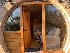A cozy seating area with a sofa and table at Cosy Escape in Sheerness
