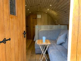 A living space with a sofa and table at Cosy Escape in Sheerness
