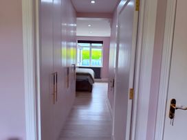 A hallway leading to a bedroom at Cherry Chirp Cottage Enniskillen