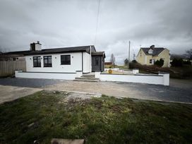 A house with a driveway and steps at Cherry Chirp Cottage Enniskillen
