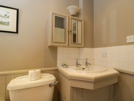 A bathroom with a sink and toilet at Foxhill Farm Barn Cheltenham