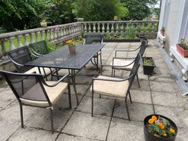 A table and chairs on a patio at Fountain Hill House in Londonderry