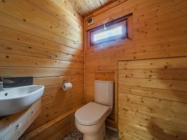 A bathroom with toilet and sink at Cotswold Nights Ashton Under Hill