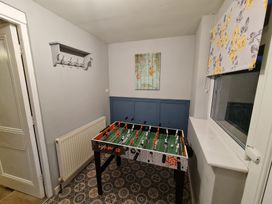 A games room with a foosball table at Sea view cottage Penmaenmawr