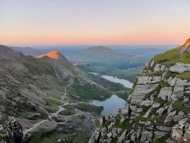A scenic view of mountains and a lake at Sea view cottage Penmaenmawr