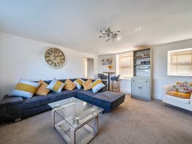 A living room with a sofa and coffee table at Sea view cottage in Penmaenmawr