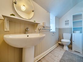 A bathroom with a sink and toilet at Sea view cottage Penmaenmawr