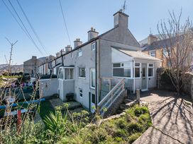 A house with a veranda and garden at Sea view cottage in Penmaenmawr
