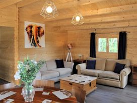 A living room with a sofa and coffee table at Cotswold Nights Away in Evesham