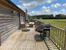 An outdoor space with a patio table and seating at Fox Lodge in York