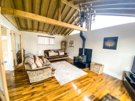 A living room with a sofa and coffee table at Fox Lodge York