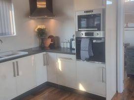 A kitchen with sink and oven at Fox Lodge in York